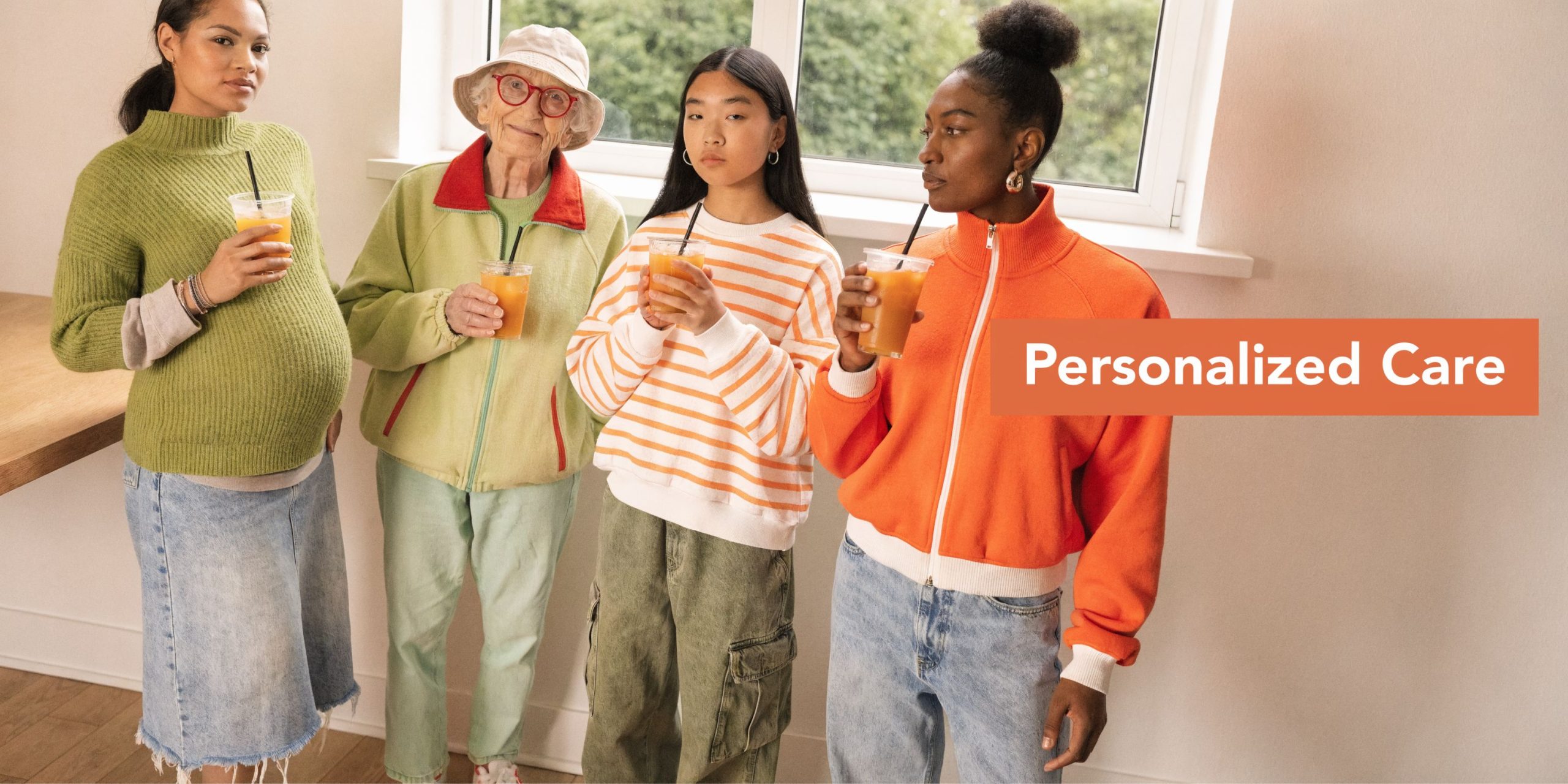 A diverse group of women standing together and holding glasses of orange juice in a bright room.