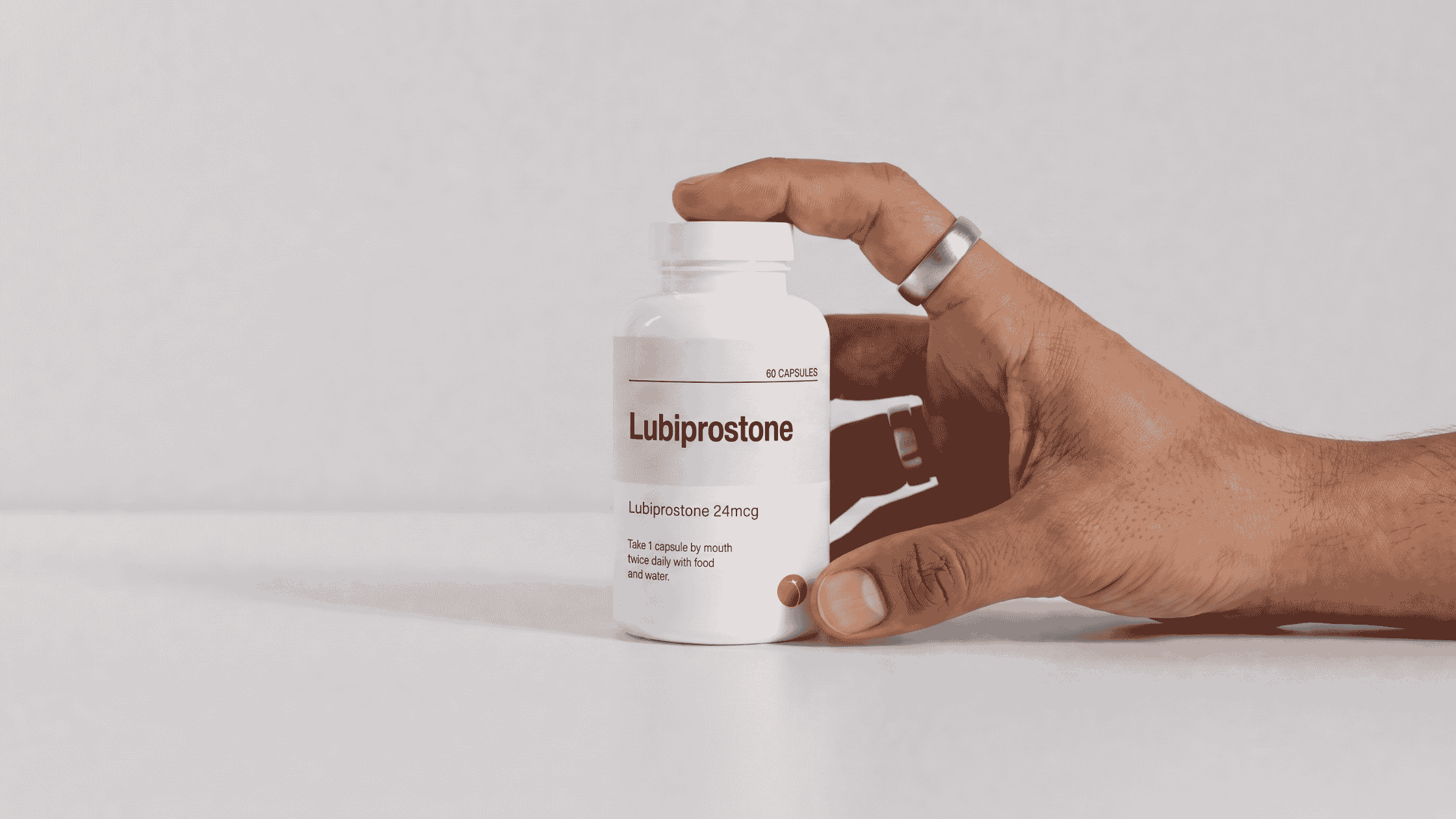 lubiprostone bottle with a hand